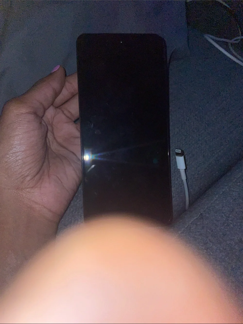 Motorola Black Smartphone with Lightning Cable Visible